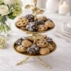 WhatsApp Image 2025-12-30 at 5.02.04 PM Premium Two-Tier Cake Stand in Stainless Steel with Antique Brass Finish – Floral & Bird Design Dessert / Cupcake / Serving Stand